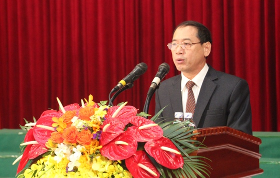 Ông Hoàng Quốc Hào, Giám đốc Sở Tư  pháp Nghệ An lên đọc báo cáo kết quả triển khai 