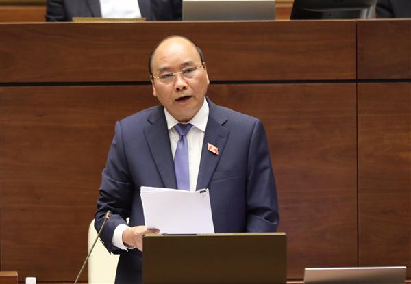 Thủ tướng Nguyễn Xuân Phúc trả lời chất vấn tại Quốc hội. - Ảnh: VGP