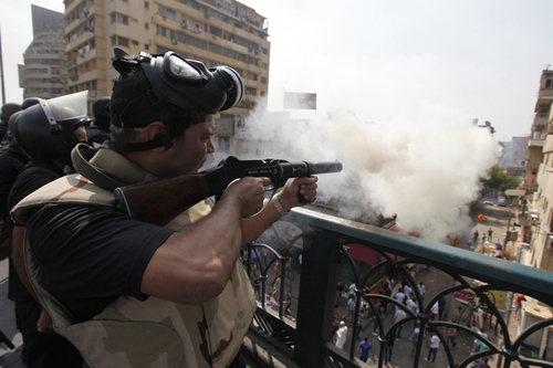 Riot police fired tear gas during clashes with members of the Muslim Brotherhood and supporters of Mr. Morsi around Cairo University and Nahdet Misr Square in Giza, south of Cairo.