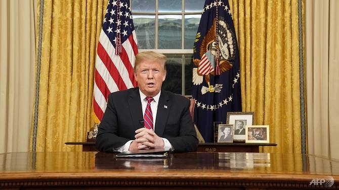 Tổng thống Mỹ Donald Trump phát biểu trên sóng truyền hình trực tiếp ngày 8/1. (Ảnh: AFP)